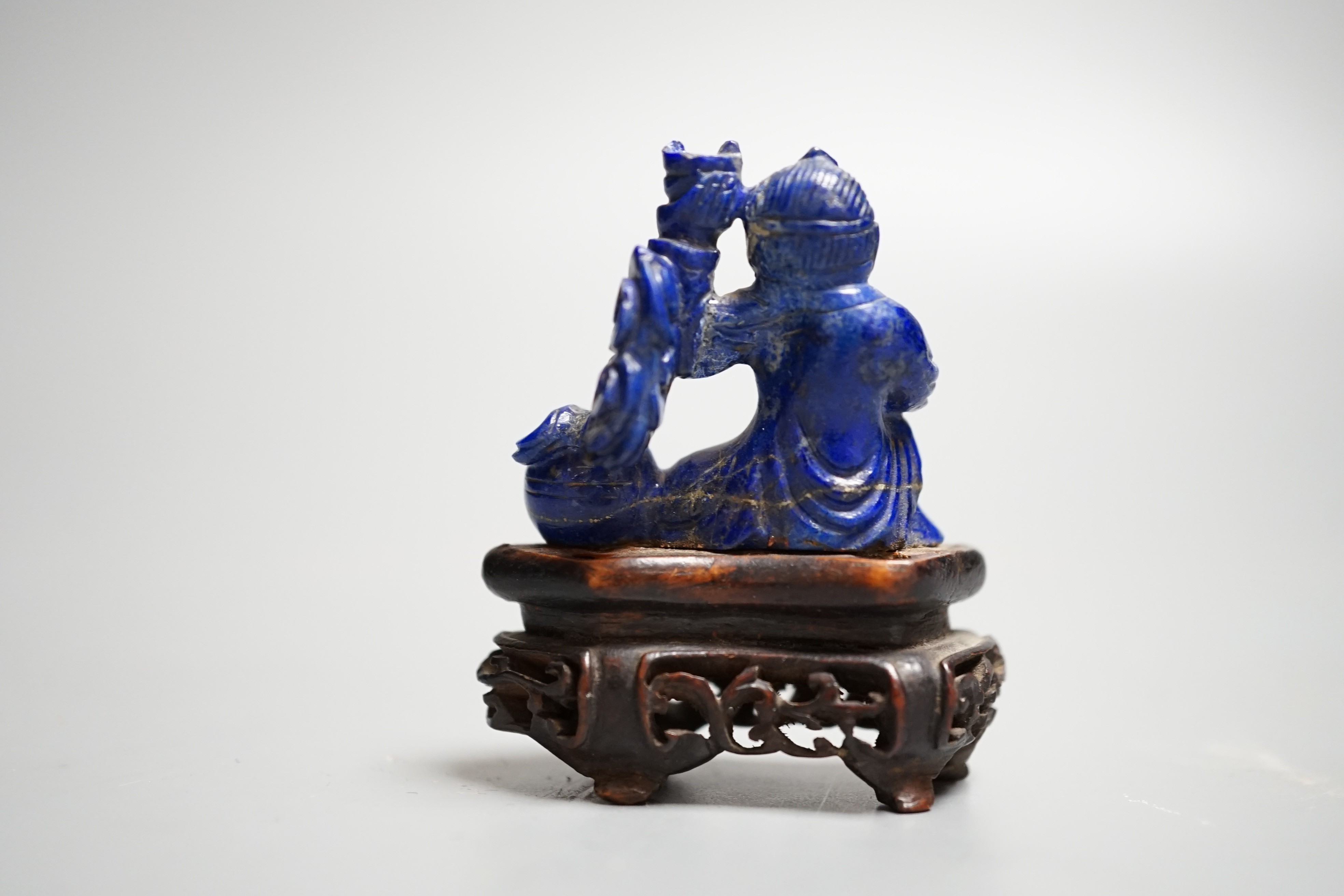 A Chinese carved lapis lazuli model of a Buddha, height 5.5cm (a.f.)